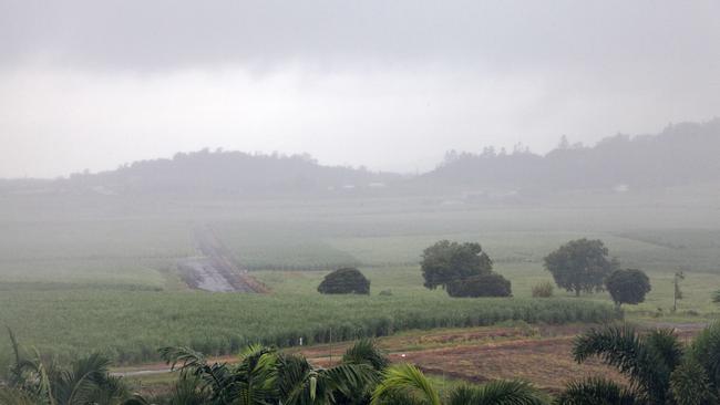 Rain falls over sugar cane fields in Mackay. It is estimated 62,000 Pacific islanders were ‘blackbirded’ into slavery in Queensland in the 19th and early 20th centuries. Picture: Liam Kidston.