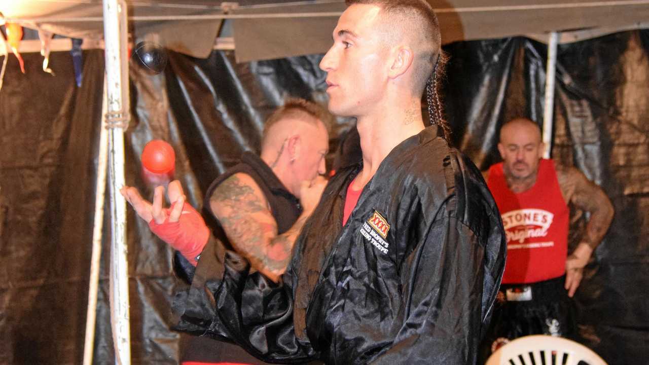 JUGGLING BOXER: Unusual warm up drills at Fred Brophy's boxing tent in Kilkivan. Picture: Matt Collins