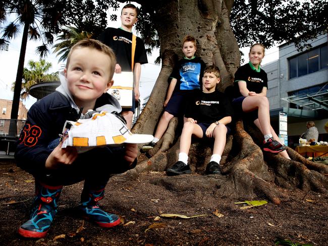 Manly Village students have come up with an invention that is a tracking device to find toddlers. Archie Partington 11, James Renton-Schmidt 9, Tal Carmel 10 and Olivia Renton-Schmidt 11 plus toddler with tracking hat is Bertie Partington 4.