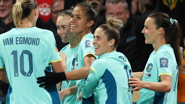 Mary Fowler (C) of Australia celebrates with teammates