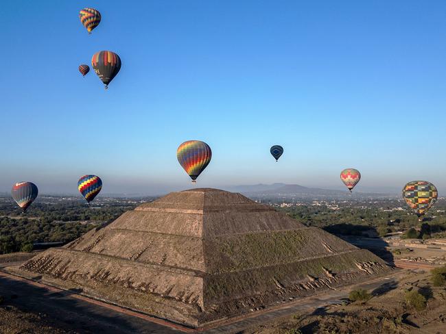 Hot air balloons fly over the Teotihuacan pyramids in Mexico State during the spring equinox celebration. Picture: Carl De Souza/AFP