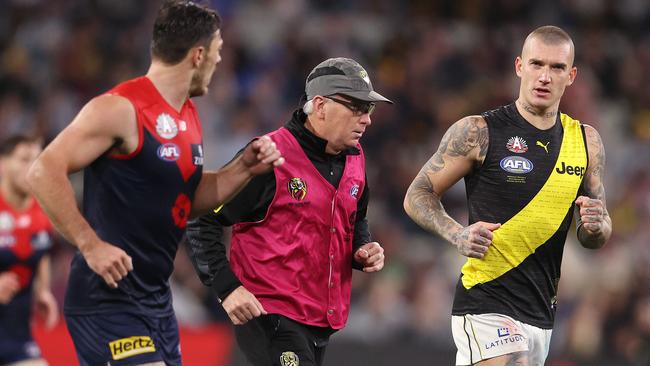 Dustin Martin comes to the bench with the doctor. Picture: Michael Klein