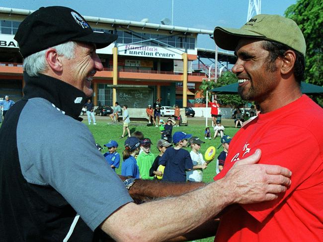 Coach Mick Malthouse shakes hands with former Eagle Chris Lewis. Collingwood's post-split round (Round 12) trip to Darwin.