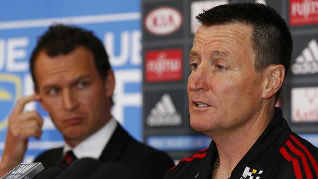 Essendon CEO Xavier Campbell looks on as John Worsfold speaks at his 2015 appointment as coach of the club. Picture: Michael Klein