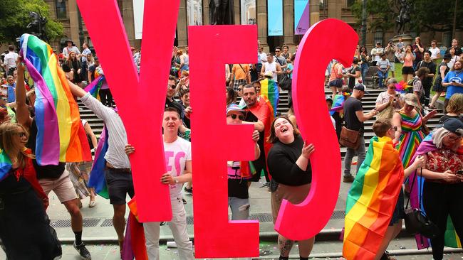 Melbourne crowd celebrate the Yes result. Picture: Scott Barbour/Getty Images