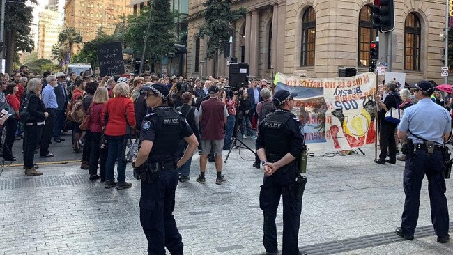 Protesters march for their right to a peaceful protest in Brisbane's CBD today.