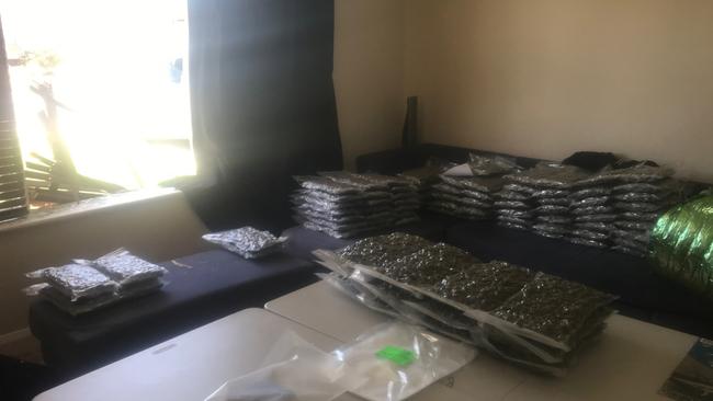 Six men have been charged with drug trafficking after the South Australia National Anti-Gangs Squad found more than 320 kilograms of dried cannabis and $50,000 cash at a suburban Adelaide property on Wednesday. Picture: AFP