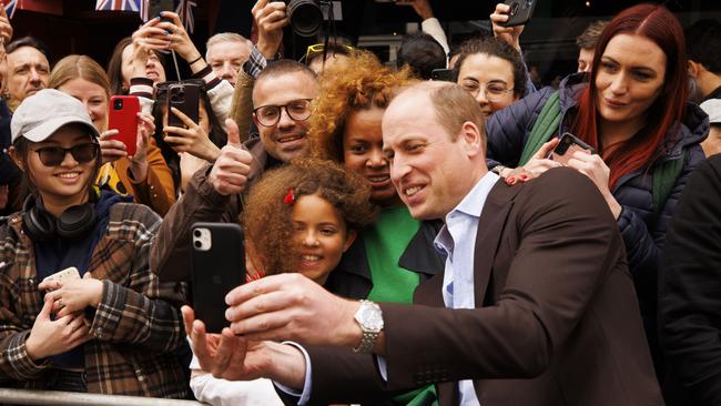 Prince William takes a selfie with a member of the public during a walkabout outside the Dog and Duck pub in Soho. Picture: WPA Pool/Getty Images.