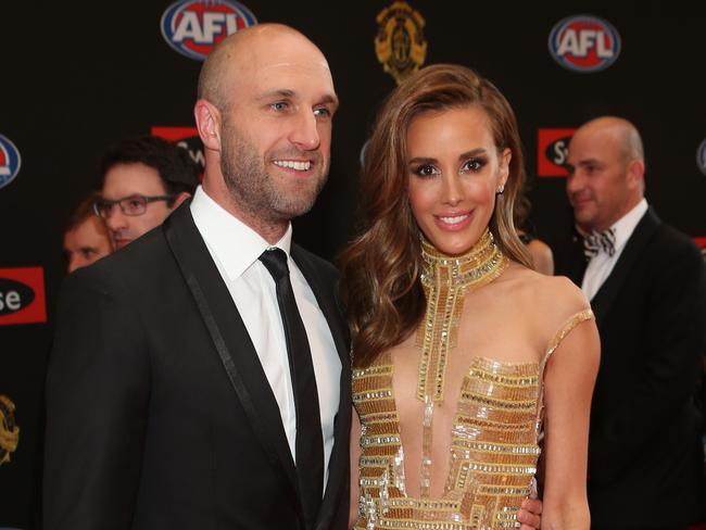 Chris and Rebecca Judd on the Brownlows red carpet. Picture: David Crosling