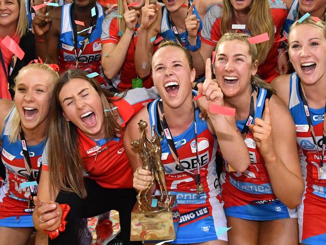 Swifts players celebrate winning the Super Netball Grand Final match between the Sunshine Coast Lightning and the New South Wales Swifts at the Brisbane Entertainment Centre in Brisbane, Sunday, September 15, 2019. (AAP Image/Darren England) NO ARCHIVING, EDITORIAL USE ONLY