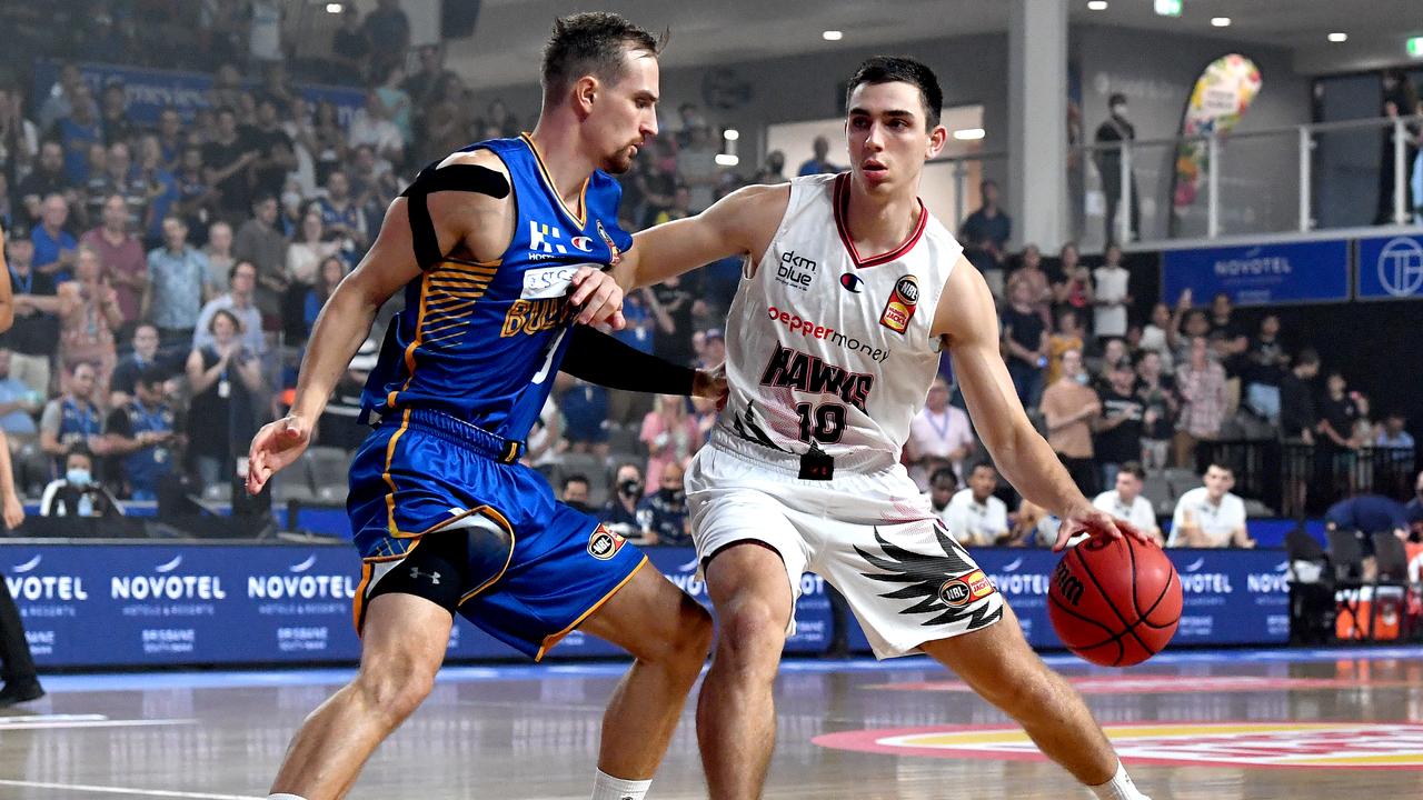 Justinian Jessup of the Hawks takes on the defence of Anthony Drmic of the Bullets. Picture: Bradley Kanaris