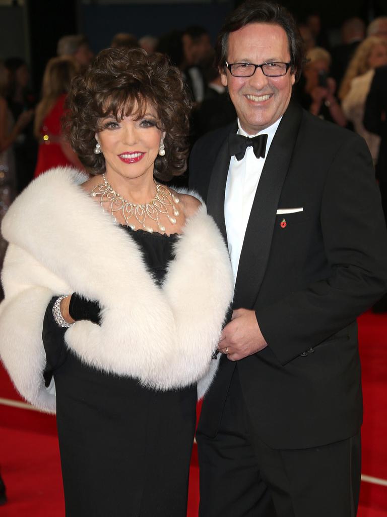 Joan Collins and Percy Gibson attend the Royal Film Performance of “Spectre”at Royal Albert Hall on October 26, 2015 in London. Picture: AP