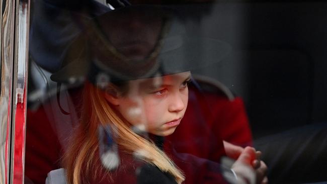 Princess Charlotte of Wales looks out of the car window as she arrives at Windsor Castle the Committal Service for Britain's Queen Elizabeth II. Picture: AFP