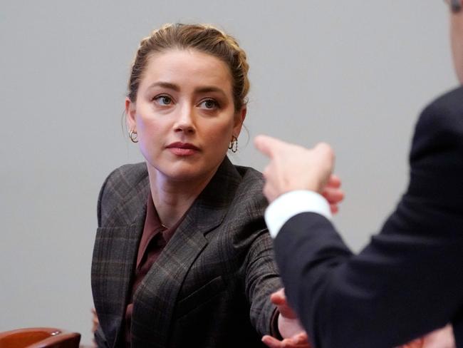 US actress Amber Heard talks to her lawyer in the courtroom at the Fairfax County Circuit Court in Fairfax, Virginia. Picture: AFP