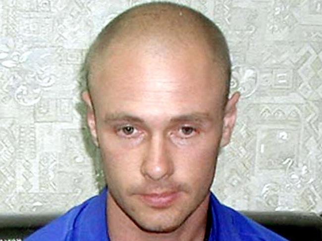 FEBRUARY 1, 2006: Jason Daron Mizner (31), an Australian man from Queensland sits with handcuffed while waiting for an interrogation at Chiang Mai police station in Chiang Mai province, 01/02/06. Mizner is wanted for sexually abusing a young girl in Australia and was arrested in northern Thailand on charges of attempting to rape a 2-year-old girl, police said Thursday.Thailand / Crime / Child Sexual Assault P/