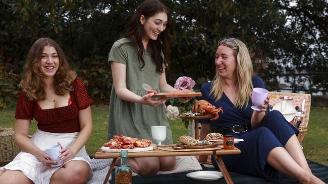 Emma Tindale, Emilie Lawson, and Lisa Hollinshead, enjoying FishMe!, a new seafood delivery service. Picture: Justin Lloyd