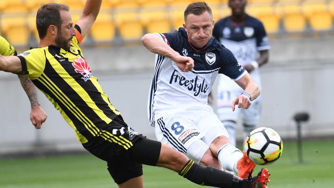 Besart Berisha unleashes a curling shot on goal.