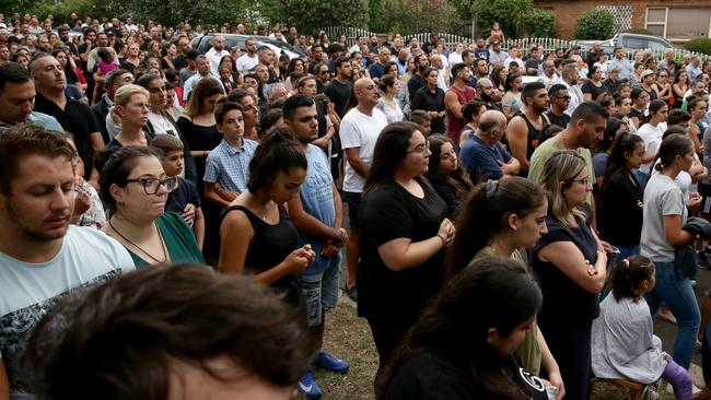 Hundreds of people gathered at the scene of the crash on Monday night to pray for the children and their families. Picture: Jonathan Ng