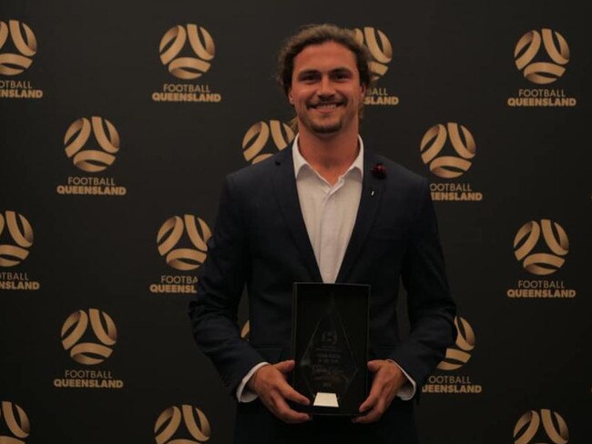 Dillon with his NPL Young Player of the Year award. Supplied.