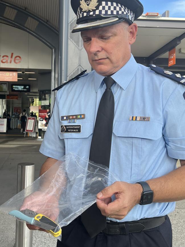 Superintendent Peter Miles with knives seized by police at Helensvale Station during an Oscar Whiskey Legion deployment.