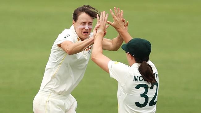 Ellyse Perry celebrates with Tahlia McGrath of Australia after taking the wicket of Sophia Dunkley. Photo by Mark Kolbe/Getty Images