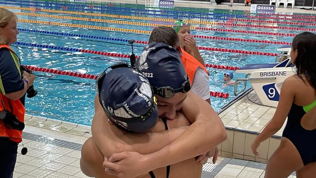 St Margaret's sisters Sophie Martin and Isabella Martin embrace after their respective QGSSSA wins.