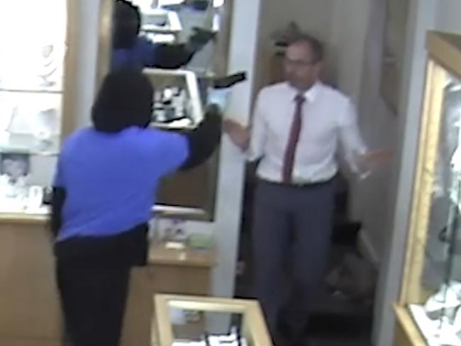 CCTV still from a Toorak jewellery store heist. the manager fights off a machete-wielding bandits at his Toorak jewellery store.