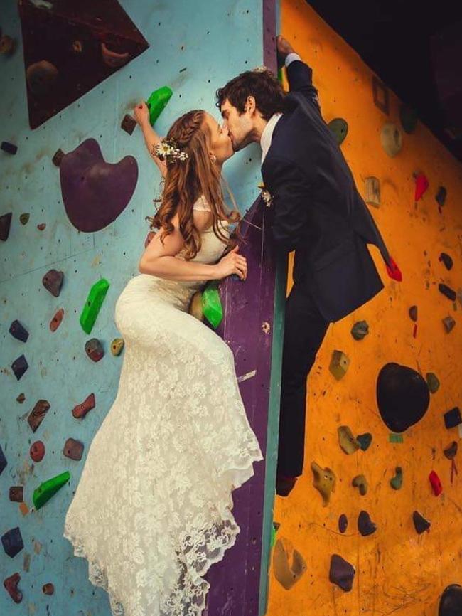 Daniel and Emma’s wedding photos included a rock climbing wall shot. Picture: Supplied by family