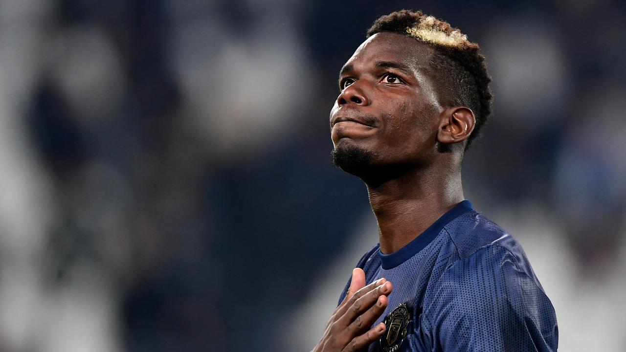 (FILES) In this file photo taken on November 07, 2018 Manchester United's French midfielder Paul Pogba acknowledges the public at the end of the UEFA Champions League group H football match Juventus vs Manchester United at the Allianz stadium in Turin. Paul Pogba will miss the upcoming World Cup for France as he needs more time to recover from knee surgery, his agent announced on October 31, 2022. (Photo by Miguel MEDINA / AFP)