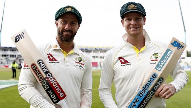 Matthew Wade and Steve Smith of Australia pose at stumps after both scoring centuries yesterday.