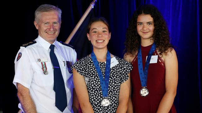 NSW Ambulance CEO Dominic Morgan presents an award to Ayumi and Aja. Picture: Toby Zerna