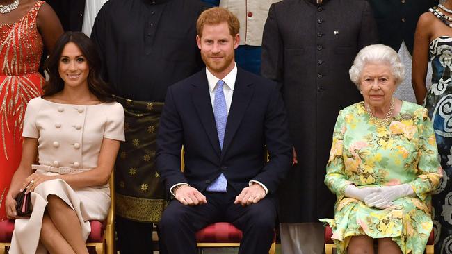 Meghan, Prince Harry, Duke and the Queen at Buckingham Palace in 2018. Picture: AFP