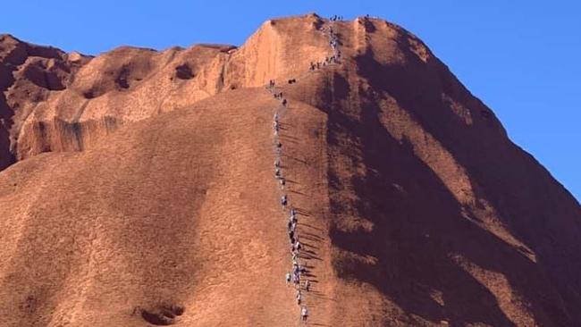 A photo of tourists climbing Uluru has left traditional landowners furious. Picture: ABC. Source: Supplied