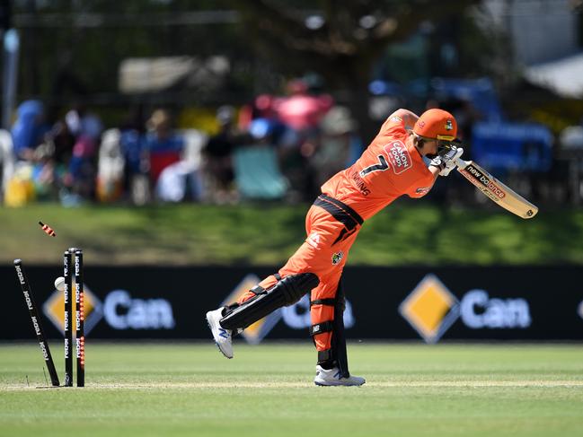 Australian captain and Scorchers star Meg Lanning has her stumps castled by Strikers star Sophie Devine. Picture: AAP