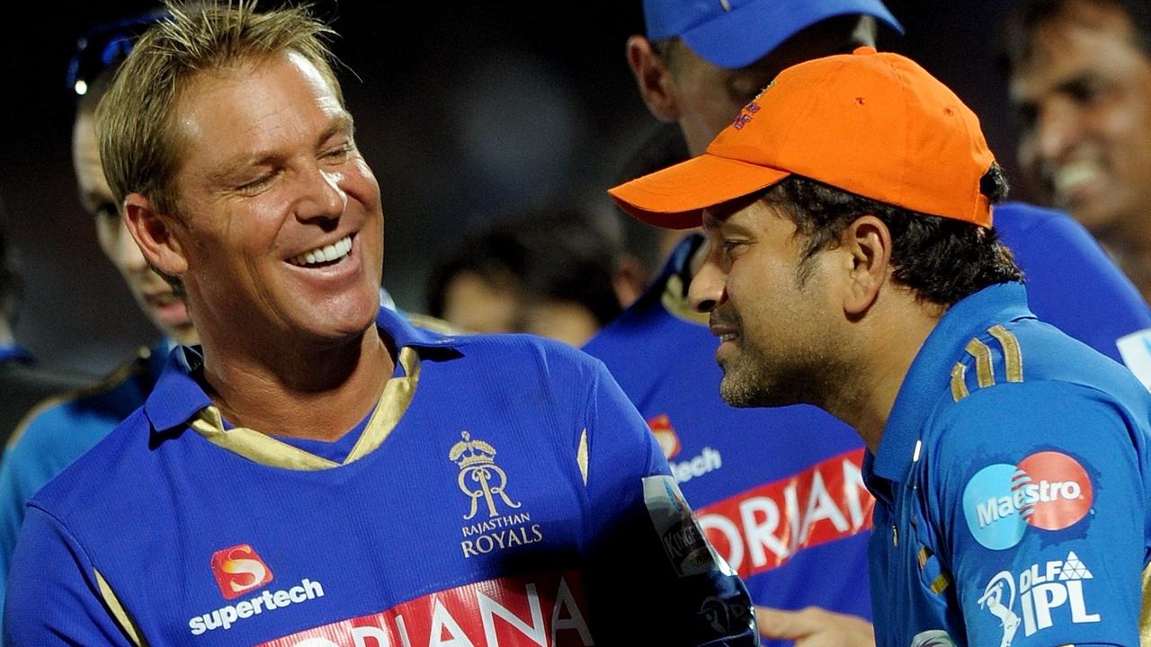 Shane Warne laughs with Sachin Tendulkar after an IPL match.