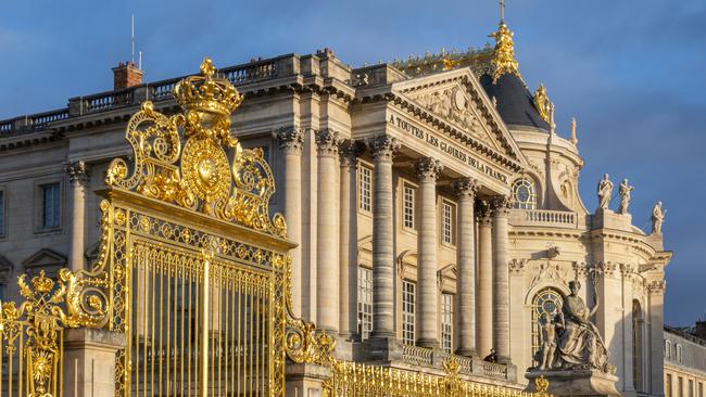 Fragment of golden entrance gates to the Versailles Palace.