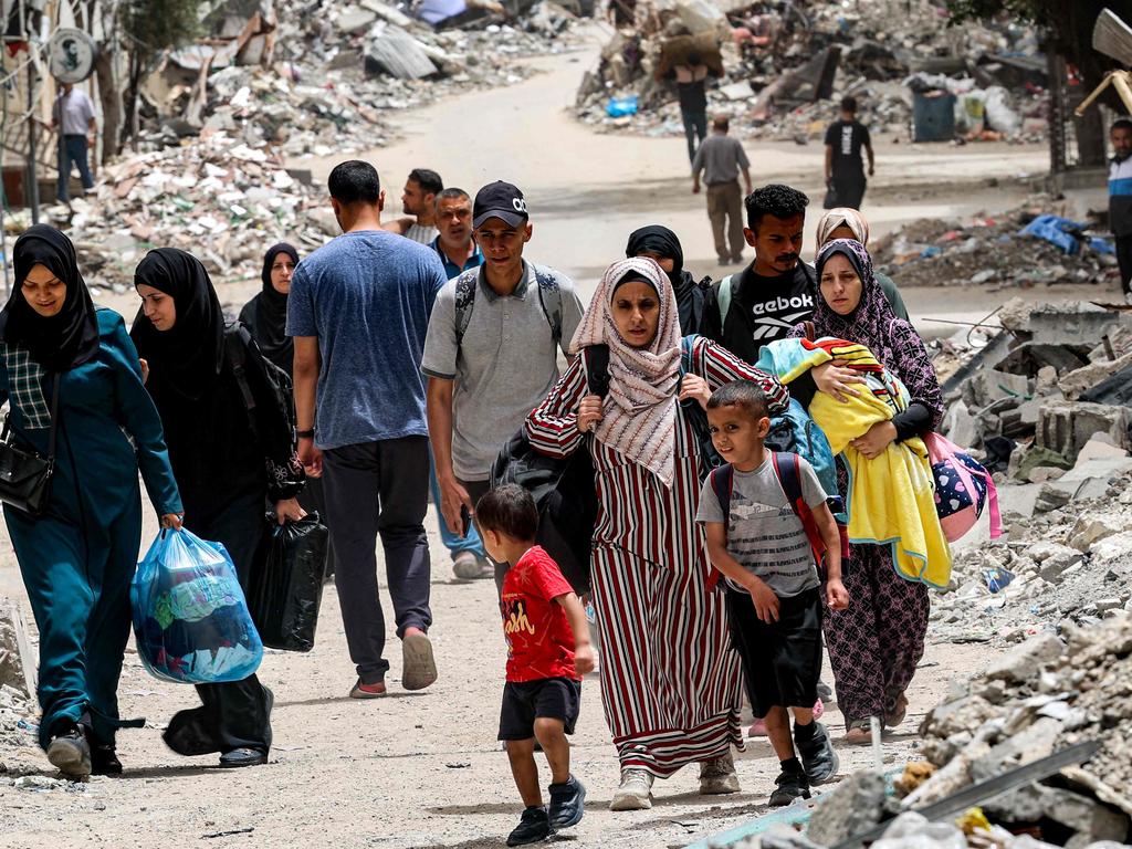 Displaced Palestinians evacuate from the Tal al-Zaatar camp for Palestinian refugees in the northern Gaza Strip on May 11, 2024 amid the ongoing conflict in the Palestinian territory between Israel and Hamas. (Photo by AFP)