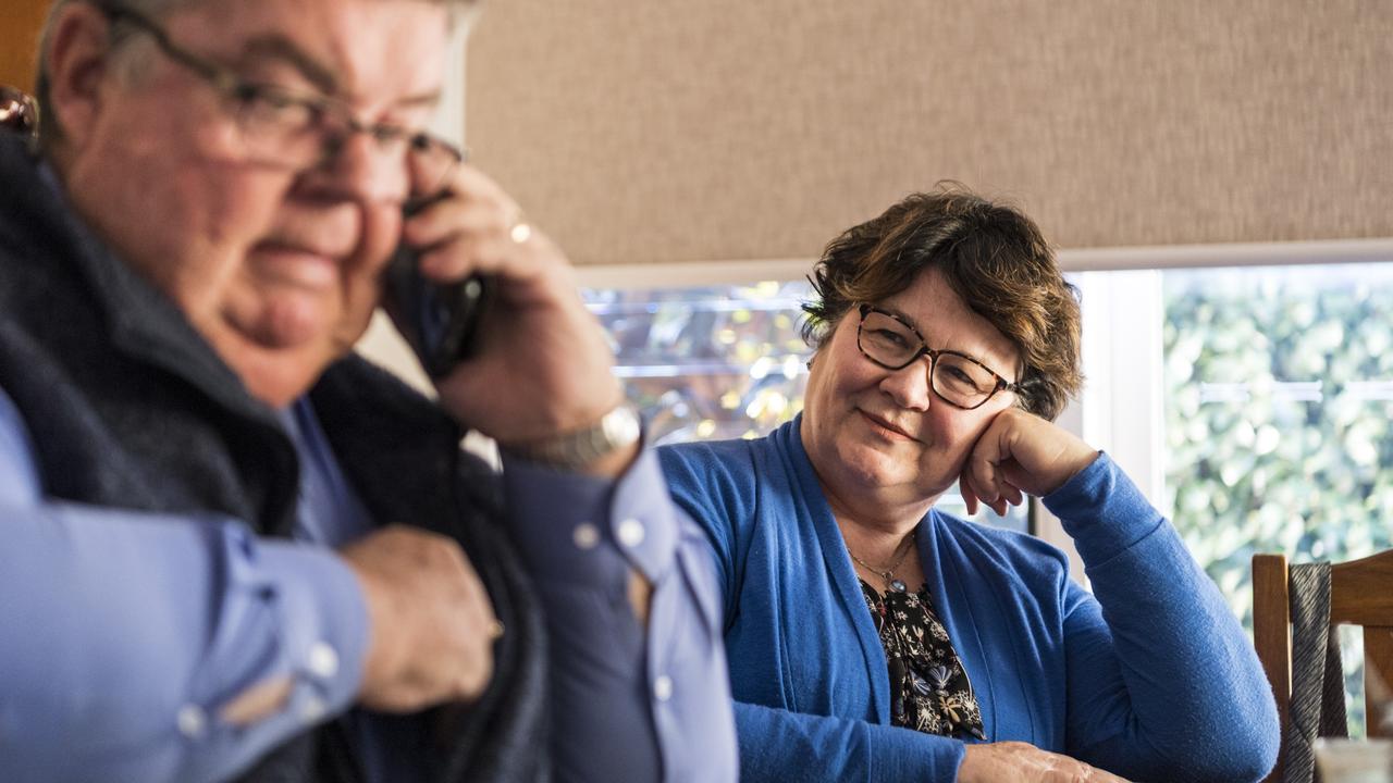 Derek Tuffield taking a work call at home with his wife Rosemerry, following the Lifeline Darling Downs CEO’s recent announcement. Mr Tuffield said one of the hardest parts of the role is having to tell some people he doesn’t have a magic want that can fix every problem, admitting these are the issues that come home with him at the end of the day. Picture: Kevin Farmer