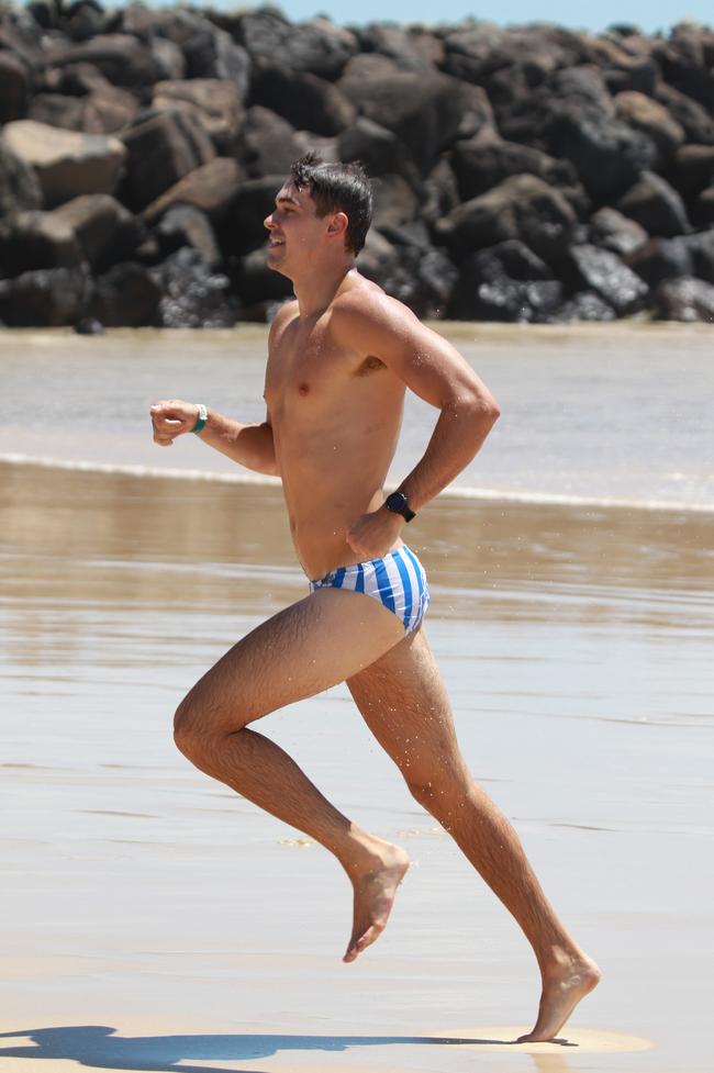 Josh Williams running out of the water during the Southport Sharks VFL team’s preseason training camp at Tallebudgera Beach. Picture: Mike Batterham
