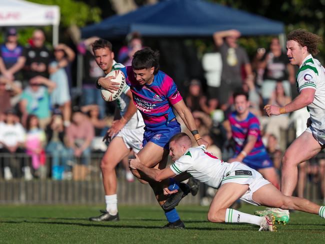 Blaine Potter with an attempted tackle of Rovers fullback Chaise Robinson. Picture: Adam Wrightson Photography