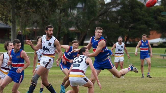 Clarke (second left) couldn’t be stopped at centre bounces, South Croydon coach Marcus Buzaglo says. Picture: Geoff Klep