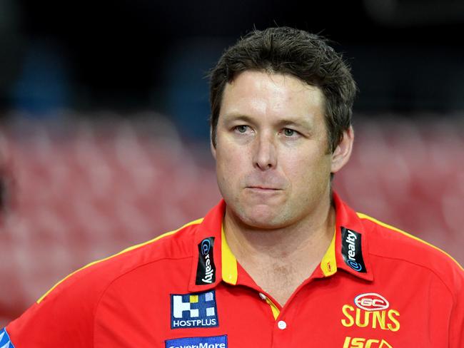 Suns coach Stuart Dew is seen during the Round 1 AFL match between the Gold Coast Suns and Port Adelaide Power at Metricon Stadium on the Gold Coast, Saturday, March 21, 2020. (AAP Image/Darren England)