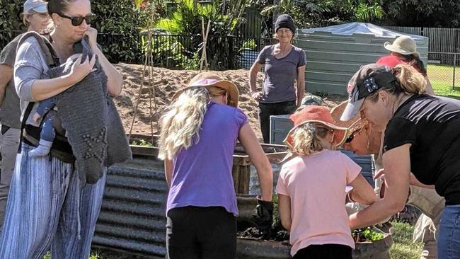 Planting out the raised beds is family fun at Jack's Paddock. Picture: contributed