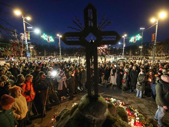 People demonstrate and pay their respect for late Russian opposition leader Alexei Navalny, at the monument for victims of political repressions in Vilnius, Lithuania. Picture: AFP