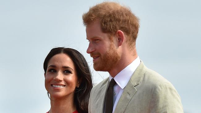 Prince Harry and his wife Meghan, arrive at Fua'amotu airport in Tonga.