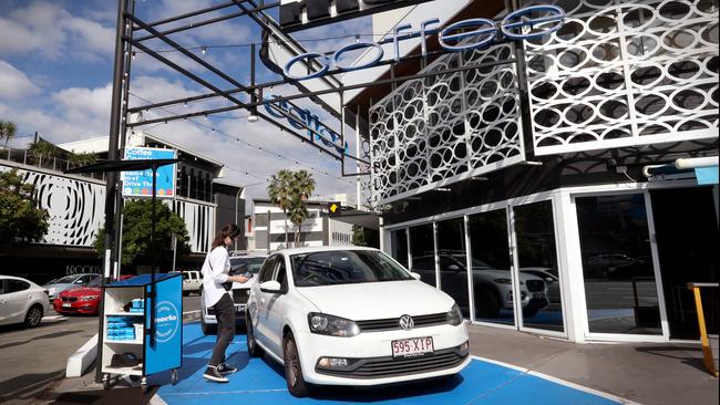 Concierge Rachel Owen takes coffee orders from drivers at Merlo Coffee’s store in Fortitude Valley. Picture: Jamie Hanson