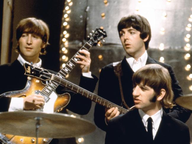 British rock band The Beatles in a promotional picture from 1966, the year of the band's seventh album release, titled 'Revolver'. L-R: John Lennon, Paul McCartney, Ringo Starr (seated at drums) and George Harrison. Picture: supplied / Universal Music Australia