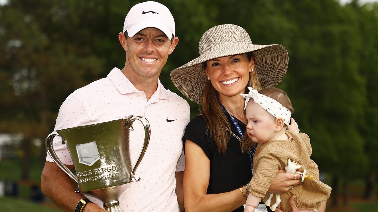 Rory McIlroy celebrates with the trophy alongside his wife Erica and daughter Poppy after winning the 2021 Wells Fargo Championship. Photo by Jared C. Tilton/Getty Images.