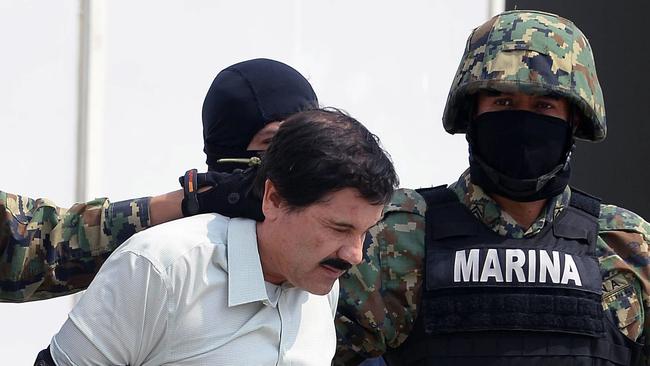 Mexican drug trafficker Joaquin Guzman Loera, aka "El Chapo" Guzman, is escorted by marines as he is presented to the press in Mexico City. Picture: AFP