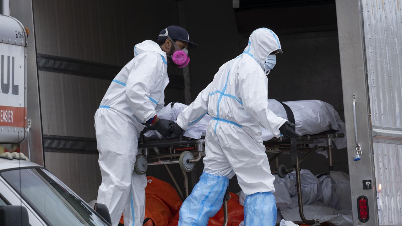 Workers move bodies to a refrigerated truck from the Andrew T. Cleckley Funeral Home in the Brooklyn borough of New York, Wednesday, April 29, 2020. Picture: AP /Craig Ruttle.